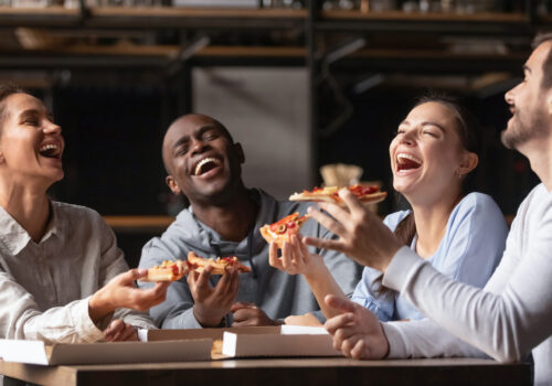 Happy,Diverse,Friends,Laughing,At,Funny,Joke,Gather,At,Table