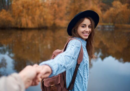 Portrait,Smiling,Pretty,Woman,In,Hat,Holding,Hand,Of,Her
